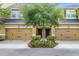 Two-story townhome featuring a symmetrical facade, dual garage doors, and a well-maintained front garden at 14430 Desert Haven St # 4302, Windermere, FL 34786