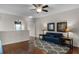 Bright and inviting living room with hardwood floors, ceiling fan, and decorative artwork at 14430 Desert Haven St # 4302, Windermere, FL 34786