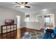 Upstairs living room with hardwood floors, modern ceiling fan, and plenty of natural light at 14430 Desert Haven St # 4302, Windermere, FL 34786