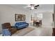 Cozy living room with comfortable seating, decorative art, and an adjacent dining area at 14430 Desert Haven St # 4302, Windermere, FL 34786