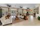 Inviting lounge area with comfortable seating, stylish decor, and access to the community pool at 14430 Desert Haven St # 4302, Windermere, FL 34786