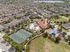 Aerial view of community amenities including a pool, tennis courts, playground, and clubhouse at 14513 Winter Stay Dr, Winter Garden, FL 34787