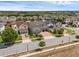 A high-angle view of a residential area featuring well-maintained lawns, homes, and a quiet street at 14513 Winter Stay Dr, Winter Garden, FL 34787