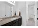 Granite countertop and dark wood cabinets add elegance to this bathroom space at 14513 Winter Stay Dr, Winter Garden, FL 34787