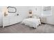 Serene bedroom featuring white walls, plush bedding, and elegant dark wood mirror at 14513 Winter Stay Dr, Winter Garden, FL 34787