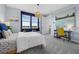 Bright bedroom with a beachy theme, featuring colorful art and a comfortable desk area at 14513 Winter Stay Dr, Winter Garden, FL 34787