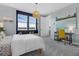 Bright bedroom with a beachy theme, featuring colorful art and a comfortable desk area at 14513 Winter Stay Dr, Winter Garden, FL 34787