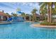 Beautiful community pool with water park, pavilion, and relaxing chairs at 14513 Winter Stay Dr, Winter Garden, FL 34787