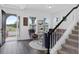 Bright and airy foyer with tile floors, staircase, and stylish decor at 14513 Winter Stay Dr, Winter Garden, FL 34787