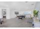Spacious game room featuring a pool table and large plant, offering a relaxing entertainment space at 14513 Winter Stay Dr, Winter Garden, FL 34787