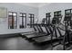 A community fitness center featuring modern treadmills and other cardio equipment, with a view of the community at 14513 Winter Stay Dr, Winter Garden, FL 34787