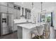 Modern kitchen featuring stainless steel appliances, an island with seating, and sleek cabinetry at 14513 Winter Stay Dr, Winter Garden, FL 34787