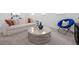 Inviting living room with a comfortable sofa, a blue chair and a stylish round coffee table at 14513 Winter Stay Dr, Winter Garden, FL 34787