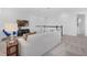 Cozy upstairs living area features white walls, plush carpet, TV, modern furniture, and decorative touches at 14513 Winter Stay Dr, Winter Garden, FL 34787
