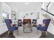 Cozy living room featuring comfortable seating, stylish decor, and a piano at 14513 Winter Stay Dr, Winter Garden, FL 34787