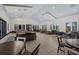 A community clubhouse lounge area with lots of natural light, tables, and comfortable modern sofas and chairs at 14513 Winter Stay Dr, Winter Garden, FL 34787