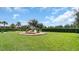 Community playground with slides and climbing structures on a well-maintained lawn at 14513 Winter Stay Dr, Winter Garden, FL 34787