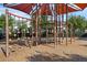 Well-equipped modern playground with climbing structure, swings, and padded ground covering offers outdoor fun at 14513 Winter Stay Dr, Winter Garden, FL 34787