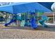 Shaded playground with slides, swings, and climbing structures, creating a safe and fun environment for  at 14513 Winter Stay Dr, Winter Garden, FL 34787