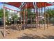 Community playground with climbing structure featuring sunshade, platforms, climbing nets, and swings for Gathering fun in the sun at 14513 Winter Stay Dr, Winter Garden, FL 34787