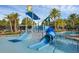A community pool featuring a waterpark area with slides and dumping bucket at 14513 Winter Stay Dr, Winter Garden, FL 34787