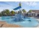 A community pool featuring a waterpark area with slides and dumping bucket at 14513 Winter Stay Dr, Winter Garden, FL 34787