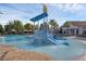 A community pool featuring a waterpark area with slide and dumping bucket at 14513 Winter Stay Dr, Winter Garden, FL 34787