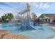A community pool featuring a waterpark area with slides and dumping bucket at 14513 Winter Stay Dr, Winter Garden, FL 34787
