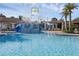 Beautiful community water park and pool with blue water and an area with slides for Gathering fun at 14513 Winter Stay Dr, Winter Garden, FL 34787