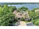 Stunning aerial view of the community clubhouse with a circular drive and professional landscaping at 1460 Lake Shadow Cir # 7102, Maitland, FL 32751