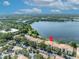 An aerial view of condos next to a lake with an indication pin on the roof at 1460 Lake Shadow Cir # 7102, Maitland, FL 32751