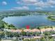 Aerial view of condos complex by a scenic lake with parking at 1460 Lake Shadow Cir # 7102, Maitland, FL 32751