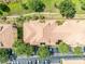 Overhead view of a building with terra cotta tile roof, parking, and lush landscaping at 1460 Lake Shadow Cir # 7102, Maitland, FL 32751