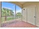 Screened balcony view with calming landscape and a private exterior door at 1460 Lake Shadow Cir # 7102, Maitland, FL 32751