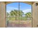 Outdoor screened in balcony, with fenced in view to a lake and tropical greenery at 1460 Lake Shadow Cir # 7102, Maitland, FL 32751