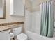 Bathroom features a combination shower and tub with toilet and sink at 1460 Lake Shadow Cir # 7102, Maitland, FL 32751