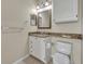 Bathroom features a granite countertop, vanity, and toilet at 1460 Lake Shadow Cir # 7102, Maitland, FL 32751