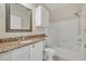 Bathroom features granite vanity and shower-tub combination at 1460 Lake Shadow Cir # 7102, Maitland, FL 32751