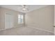 Well lit bedroom features a ceiling fan, neutral paint, and a lake view at 1460 Lake Shadow Cir # 7102, Maitland, FL 32751