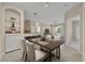 Open-concept dining room with elegant table setting, built-in shelving, and view of the living area at 1460 Lake Shadow Cir # 7102, Maitland, FL 32751
