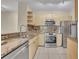 Stylish kitchen showcasing modern stainless steel appliances and granite countertops at 1460 Lake Shadow Cir # 7102, Maitland, FL 32751