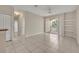 Living area with ceramic tile flooring, neutral colored walls and sliding doors to balcony at 1460 Lake Shadow Cir # 7102, Maitland, FL 32751