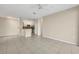Bright living area featuring neutral walls, a ceiling fan, and easy access to the kitchen at 1460 Lake Shadow Cir # 7102, Maitland, FL 32751