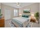 Comfortable main bedroom with fan, accent rug, and lake view at 1460 Lake Shadow Cir # 7102, Maitland, FL 32751