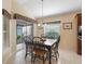 Cozy breakfast nook with sliding glass doors and floral valances at 1642 Pennecamp Dr, The Villages, FL 32162