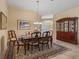 Dining room featuring a wood table, six chairs, and traditional furnishings at 1642 Pennecamp Dr, The Villages, FL 32162