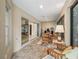The Florida room features tile flooring, ceiling fan, and sliding glass doors, offering versatile living space at 1642 Pennecamp Dr, The Villages, FL 32162