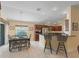 Bright kitchen with stainless steel appliances and dark wood cabinetry at 1642 Pennecamp Dr, The Villages, FL 32162