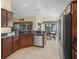 Modern kitchen with breakfast bar and stainless steel appliances at 1642 Pennecamp Dr, The Villages, FL 32162