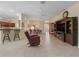 Spacious living room features a large entertainment center and comfortable leather recliners at 1642 Pennecamp Dr, The Villages, FL 32162
